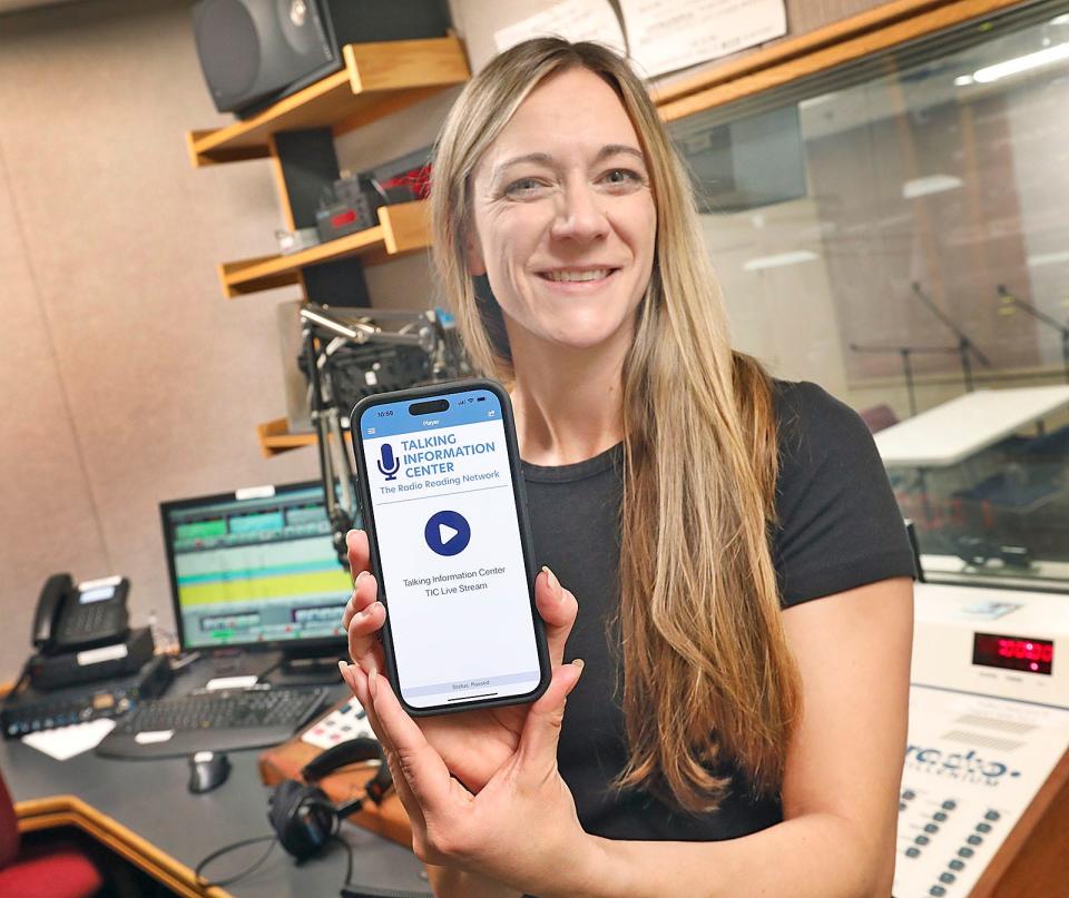 Anna Dunbar, executive director of the Talking Information Center in Marshfield, shows the nonprofit's new mobile app Monday, Feb. 27, 2023.