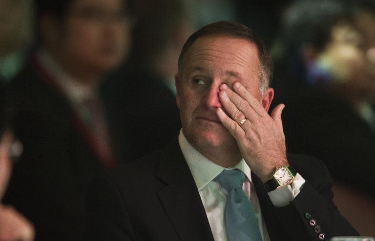 New Zealand Prime Minister John Key listens to a speech in Auckland, on November 21, 2014