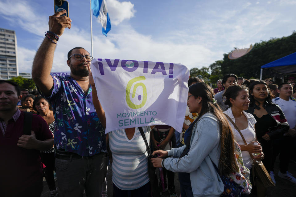 Supporters of Semilla party celebrate at Constitution square in Guatemala City, Monday, June 26, 2023. Semilla's presidential candidate Bernardo Arevalo and former First Lady Sandra Torres of UNE party go to an Aug. 20 runoff. (AP Photo/Moises Castillo)