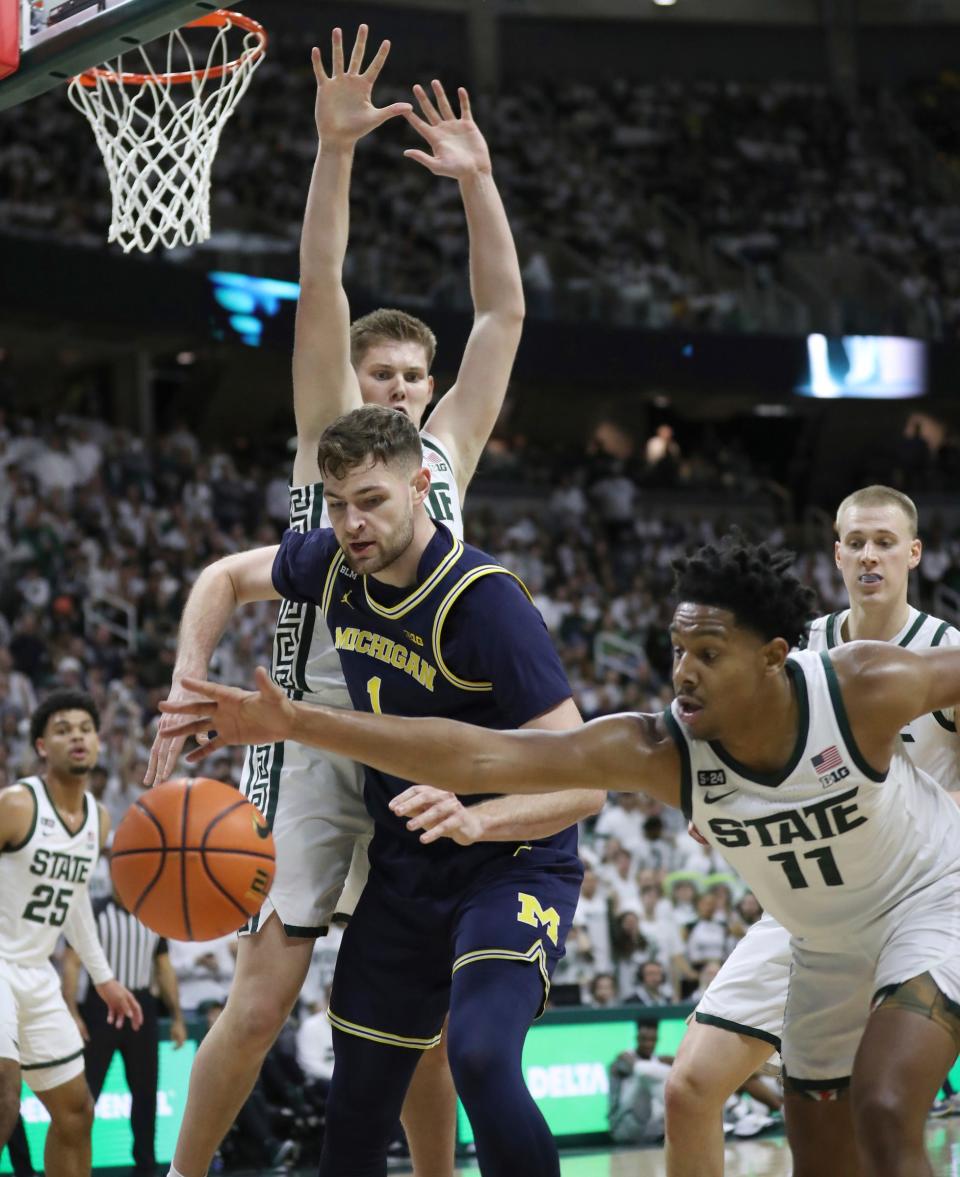 Michigan State forward Jaxon Kohler defends as guard A.J. Hoggard steals the ball from Michigan center Hunter Dickinson during the first half on Saturday, Jan. 7, 2023, at Breslin Center.