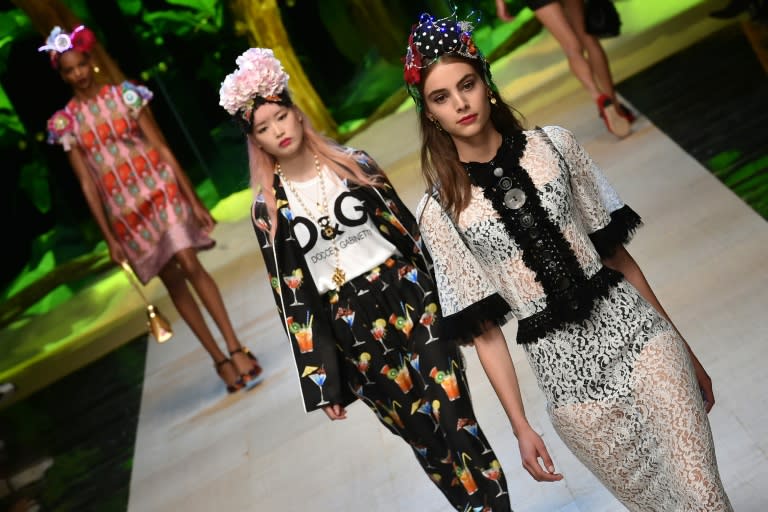 Models present creations for fashion house Dolce Gabbana on September 25, 2016 in Milan