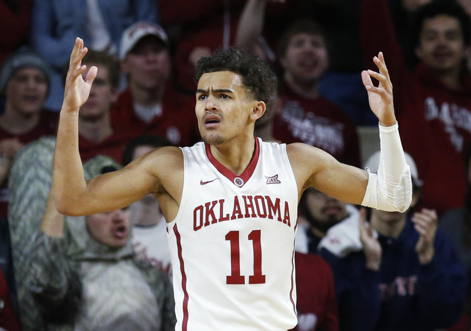 Oklahoma guard Trae Young (11) gestures following a call in the first half of an NCAA college basketball game against Texas in Norman, Okla., Saturday, Feb. 17, 2018. (AP)