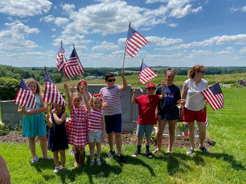 These youngsters were among the group that worked to place American flags on graves of veterans on May 29, 2022, in the Minerva area.