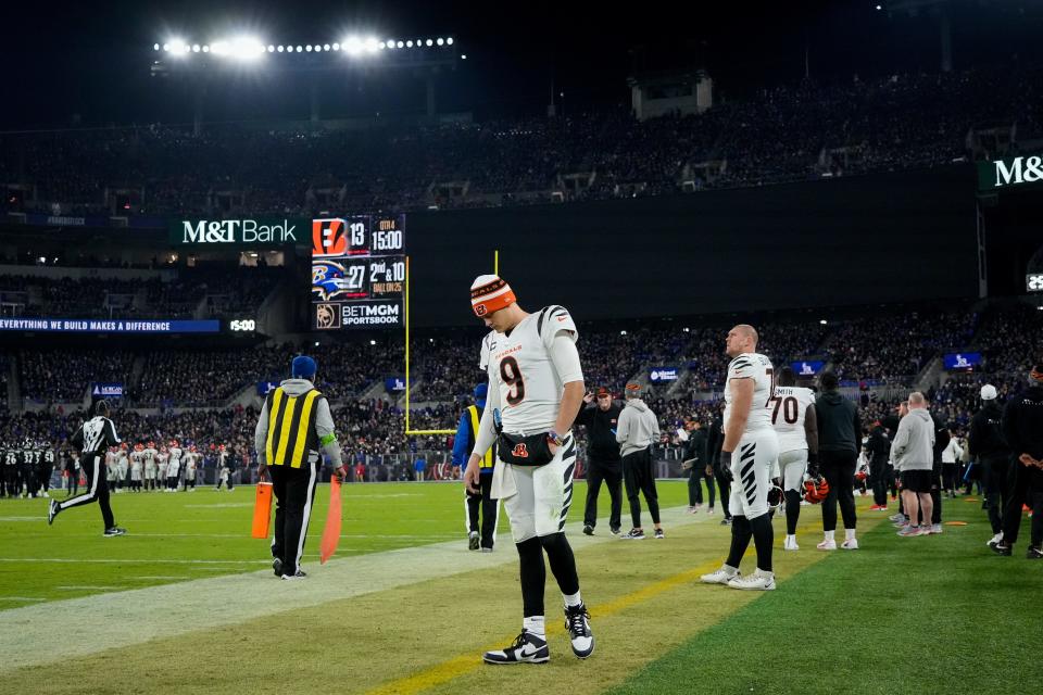 Injured Cincinnati Bengals quarterback Joe Burrow (9) paces the sideline in the fourth quarter of the NFL Week 11 game between the Baltimore Ravens and the Cincinnati Bengals at M&T Bank Stadium in Baltimore on Thursday, Nov. 16, 2023. The Bengals fell to the Ravens, 34-20.