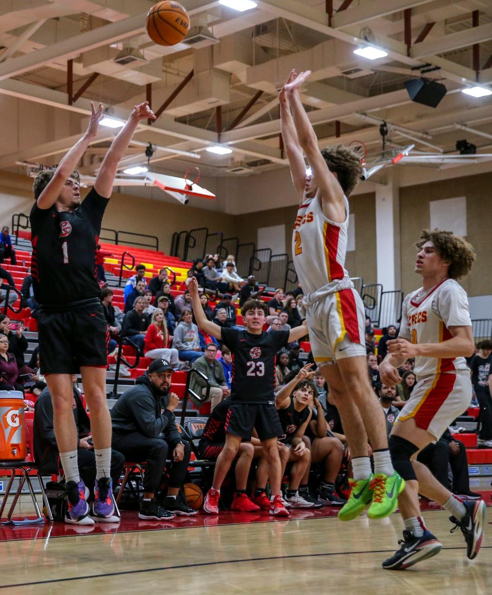 Palm Springs' Zach Buley (1) shoots for three as Palm Desert's Coby Christensen (2) defends during the third quarter of their game in Palm Desert, Calif., Thursday, Feb. 1, 2024.