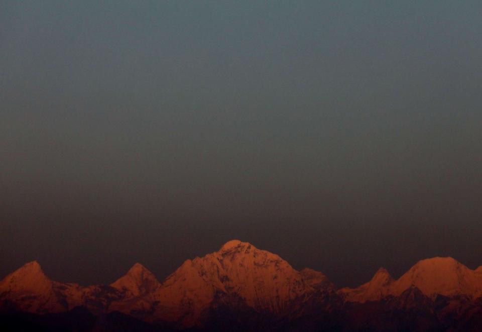 FILE PHOTO: In this file photo, Mount Everest, the world's highest peak, and other peaks of the Himalayan range are seen during the sunset on a clear day from Kathmandu, Nepal, on October 17, 2022. (Navesh Chitrakar/Reuters)