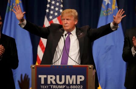 Donald Trump addresses supporters after being declared by the television networks as the winner of the Nevada Republican caucuses at his caucus night rally in Las Vegas. REUTERS/Jim Young