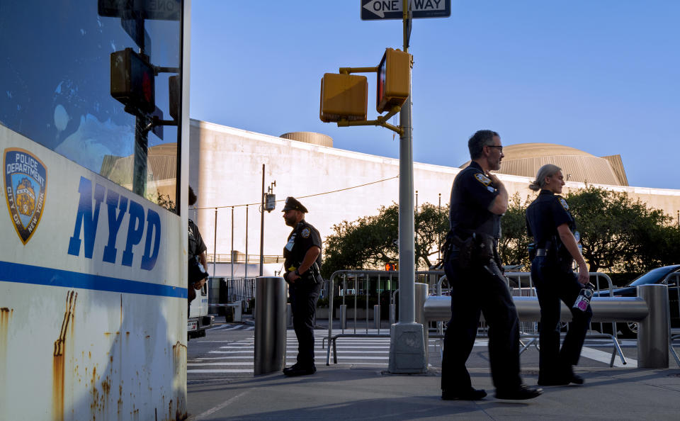 Members of the New York City Police Department walk near the United Nations headquarters, Sunday, Sept. 19, 2021, in New York. The 76th Session of the U.N. General Assembly begins this week. (AP Photo/Craig Ruttle)