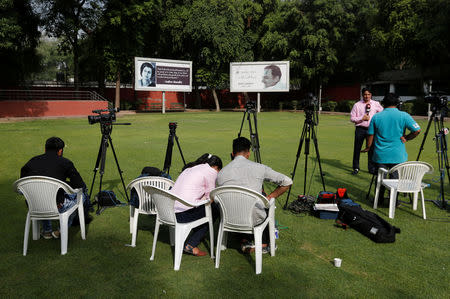 Members of the media sit at the Congress party headquarters in New Delhi, India, May 23, 2019. REUTERS/Adnan Abidi