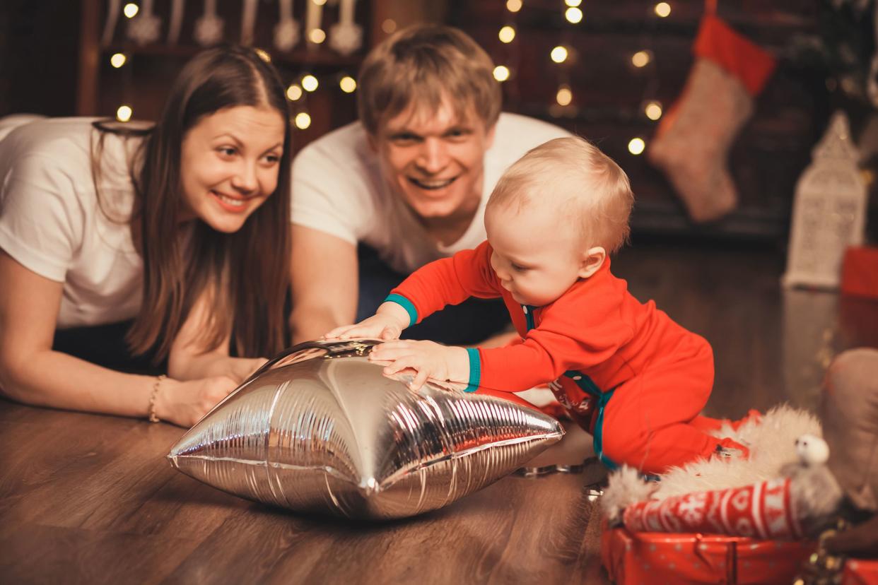 mother, father and little son playing