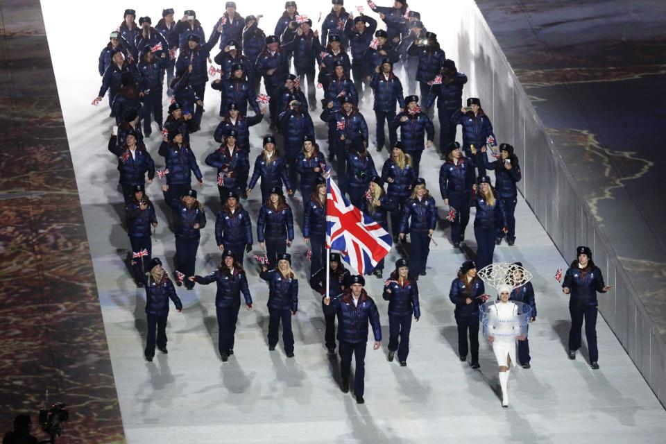 Jon Eley of Britain carries the national flag as he leads the team during the opening ceremony of the 2014 Winter Olympics in Sochi, Russia, Friday, Feb. 7, 2014. (AP Photo/Robert F. Bukaty)