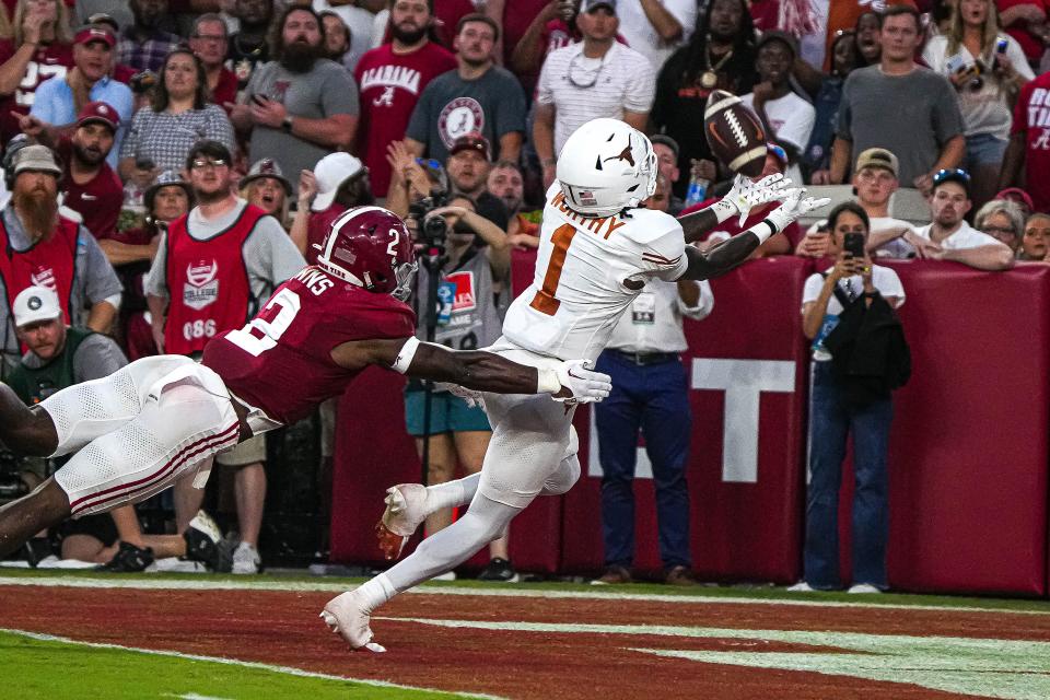 Texas Longhorns wide receiver <a class="link " href="https://sports.yahoo.com/ncaaf/players/328067" data-i13n="sec:content-canvas;subsec:anchor_text;elm:context_link" data-ylk="slk:Xavier Worthy;sec:content-canvas;subsec:anchor_text;elm:context_link;itc:0">Xavier Worthy</a> (1) reaches for a touchdown catch against <a class="link " href="https://sports.yahoo.com/ncaaf/teams/alabama/" data-i13n="sec:content-canvas;subsec:anchor_text;elm:context_link" data-ylk="slk:Alabama;sec:content-canvas;subsec:anchor_text;elm:context_link;itc:0">Alabama</a> at Bryant-Denny Stadium on Saturday, Sep. 9, 2023 in Tuscaloosa, Alabama.