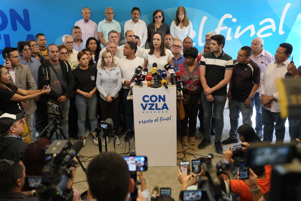 Opposition leader María Corina Machado, who faces a government ban on her running for office, holds a press conference in Caracas, Venezuela, Tuesday, March 26, 2024. The main Venezuelan opposition coalition said early Tuesday that electoral authorities didn’t let it register its presidential candidate Corina Yoris as the deadline ended. (AP Photo/Ariana Cubillos)