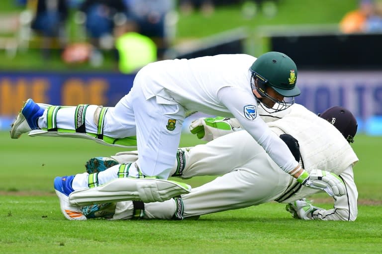 South Africa's Dean Elgar (front) runs into New Zealand's keeper BJ Watling during day four of the first international cricket test in Dunedin