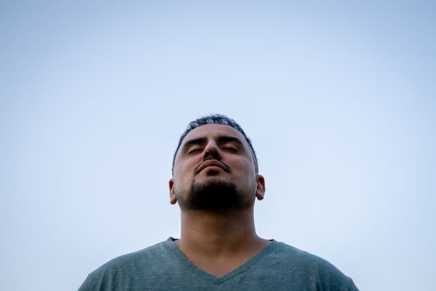 Hafiz Akbarzada, an Afghan refugee and former pilot, poses in his Colorado neighborhood on Sept. 12, 2022. Akbarzada, who dreams of flying once again, is soon starting a customer service job with United Airlines and plans to begin training to get back in the air. (Photo: Eli Imadali for HuffPost)