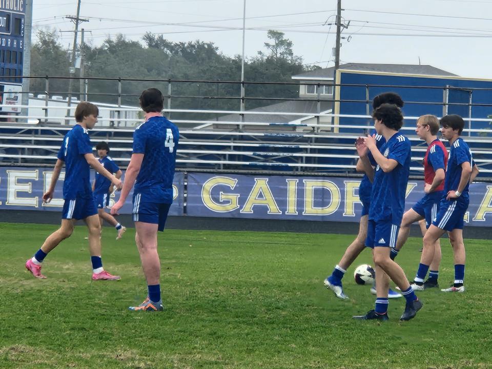 Vandebilt Catholic soccer players warming up before Friday's LHSAA semifinal against U-High.