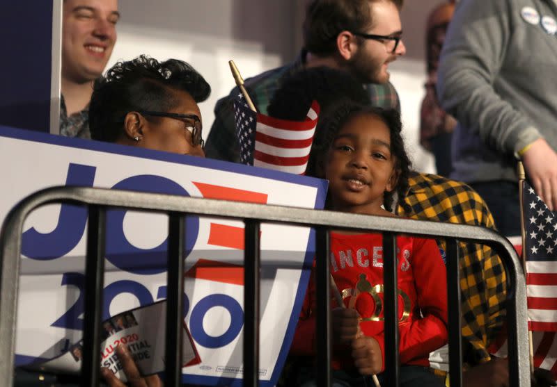 Supporters of Democratic U.S. presidential candidate and former Vice President Biden listen to voting results announced at his South Carolina primary night rally in Columbia