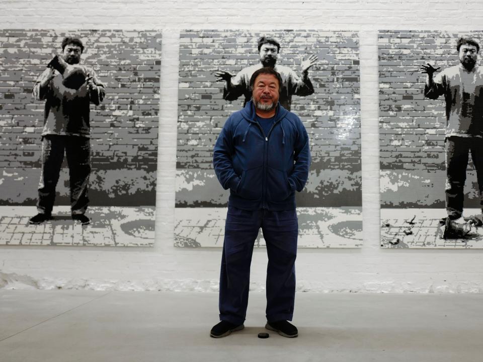 Ai Weiwei in front of his work, Dropping a Han Dynasty Urn, 2016, at his studio in BerlinAFP via Getty