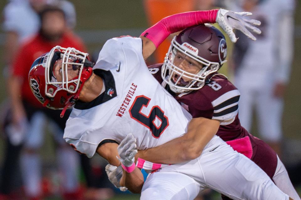 Canal Winchester's Braylon Beckwith breaks up a pass intended for Westerville South's Jordan Wheeler during their game Oct. 6.