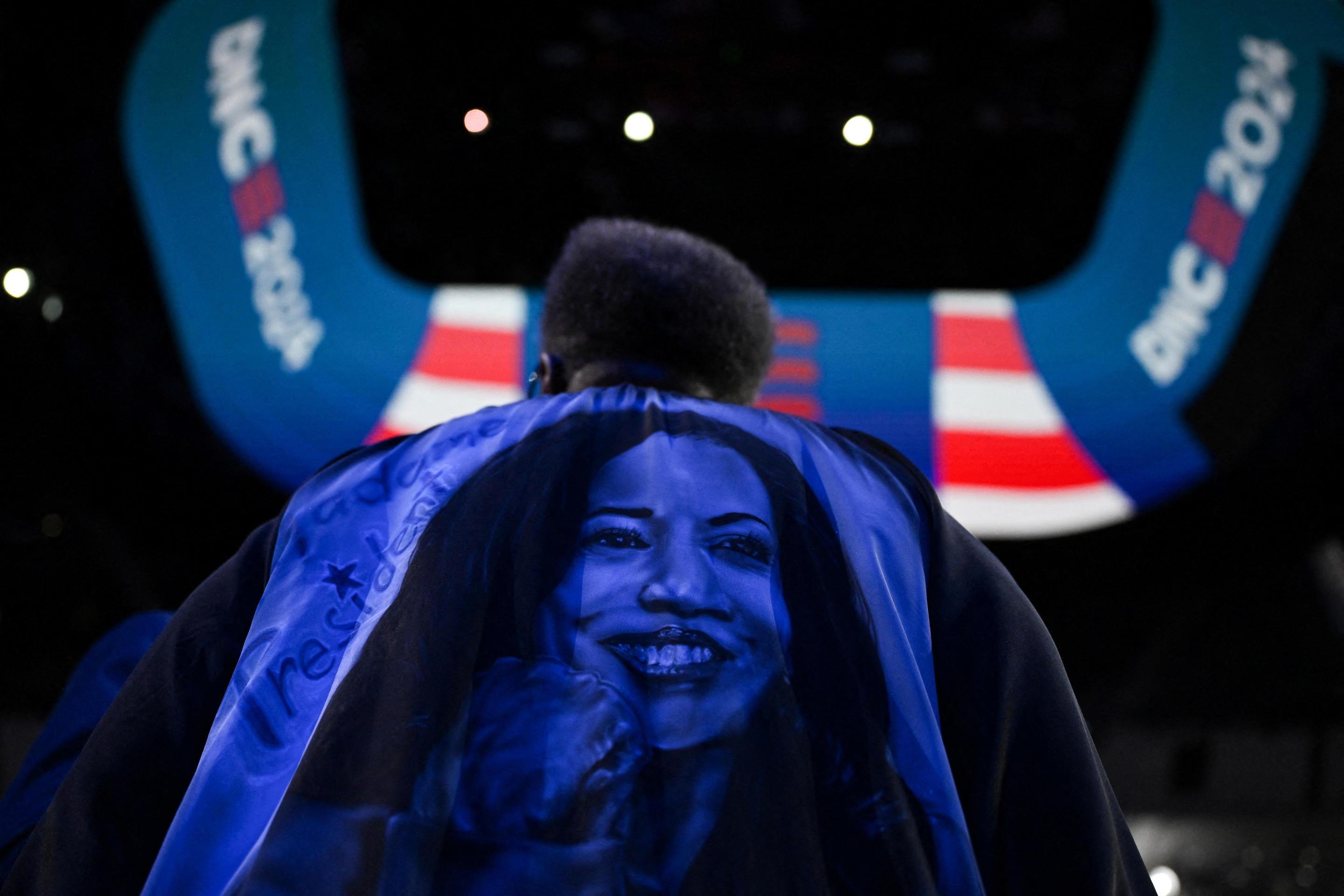 Wisconsin delegate Thelma Sias, 71, wears a handmade cape depicting Vice President Kamala Harris at the convention Tuesday. (Callaghan O'Hare/Reuters)