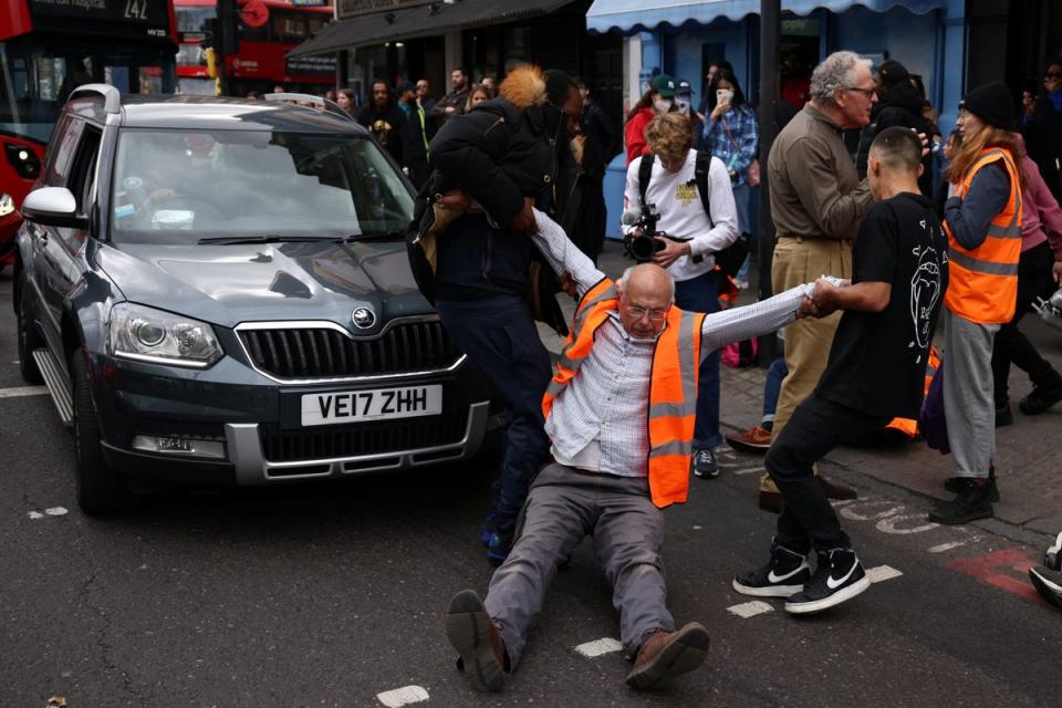 Clashes between bystanders and activists at the Just Stop Oil protest (Reuters)