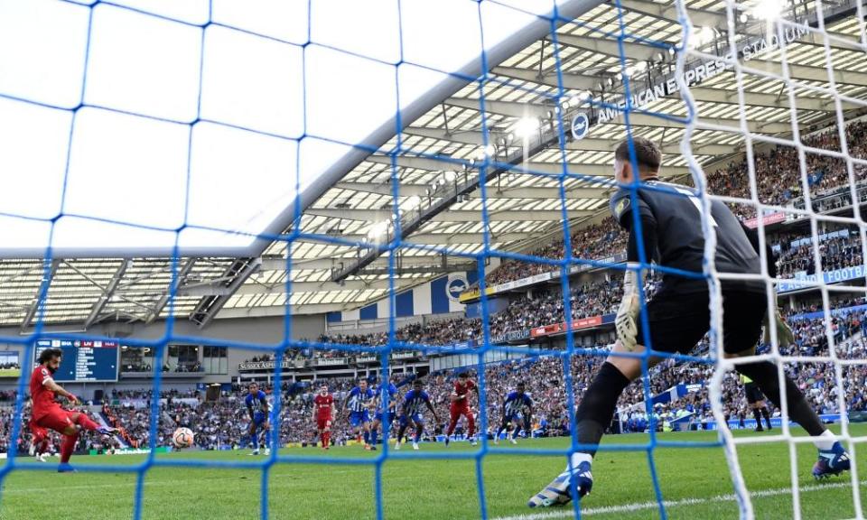 Mohamed Salah converts a penalty for his second goal at the Amex Stadium