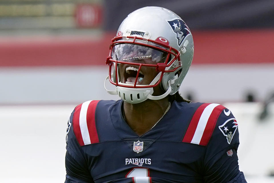 New England Patriots quarterback Cam Newton shouts as he warms up before an NFL football game against the Miami Dolphins, Sunday, Sept. 13, 2020, in Foxborough, Mass. (AP Photo/Steven Senne)