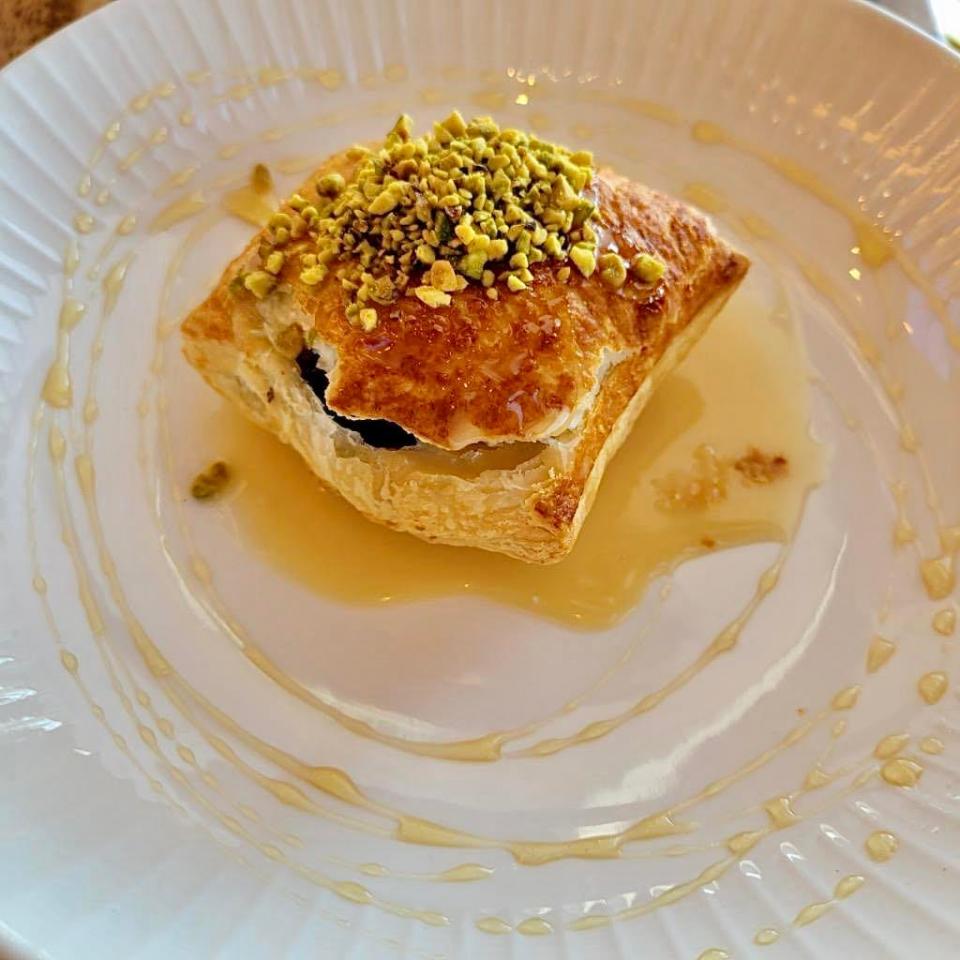 A fig and pistachio puff pastry served at The Bistro