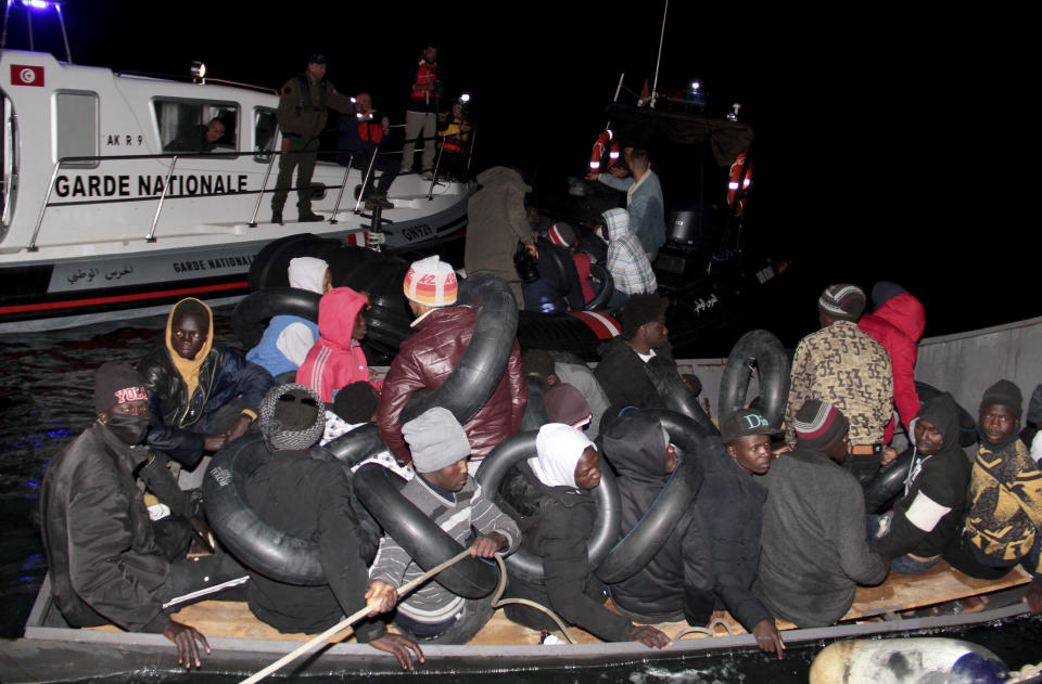 Migrants, mainly from sub-Saharan Africa, are stopped by Tunisian Maritime National Guard at sea during an attempt to get to Italy, near the coast of Sfax, Tunisia, Tuesday, April 18, 2023. The Associated Press, on a recent overnight expedition with the National Guard, witnessed migrants pleading to continue their journeys to Italy in unseaworthy vessels, some taking on water. Over 14 hours, 372 people were plucked from their fragile boats. (AP Photo)