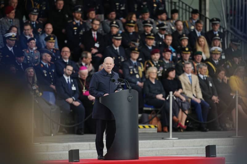 German Chancellor Olaf Scholz delivers a speech during during a final ceremony in honour of soldiers deployed in Mali, in front of the German Ministry of Defence. Kay Nietfeld/dpa