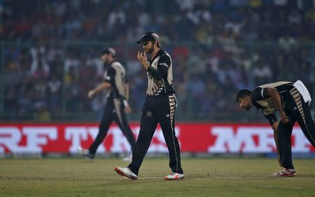 Cricket - England v New Zealand - World Twenty20 cricket tournament semi-final - New Delhi, India - 30/03/2016. New Zealand's captain Kane Williamson (C) walks on the field. REUTERS/Adnan Abidi