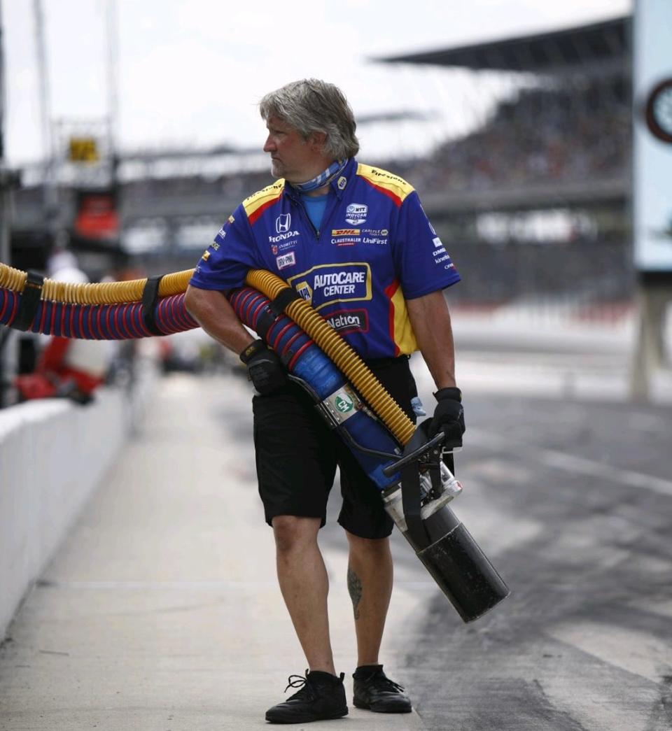 Michael Trimmer, who works on the pit crew for Andretti Autosport is shown on pit road at IMS in 2020. Trimmer said to be a fueler during pit stops he has to be in shape like an elite athlete.