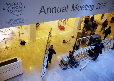 Workers prepares the congress centre ahead of the Annual Meeting 2016 of the World Economic Forum (WEF) in Davos, Switzerland, January 18, 2016. REUTERS/Ruben Sprich