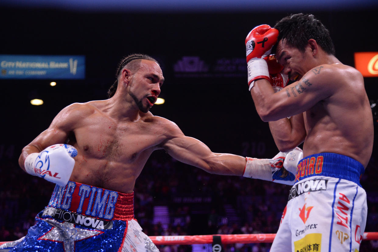 Jul 20, 2019; Las Vegas, NV, USA; Manny Pacquiao (white trunks) and Keith Thurman (red/white/blue trunks) box during their WBA welterweight championship bout at MGM Grand Garden Arena. Pacquiao won via split decision. Mandatory Credit: Joe Camporeale-USA TODAY Sports