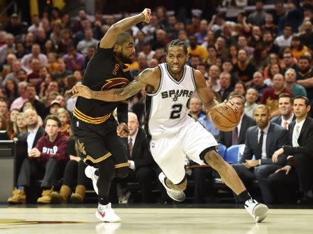 Jan 21, 2017; Cleveland, OH, USA; San Antonio Spurs forward Kawhi Leonard (2) drives to the basket against Cleveland Cavaliers guard Kyrie Irving (2) during the second half at Quicken Loans Arena. Mandatory Credit: Ken Blaze-USA TODAY Sports