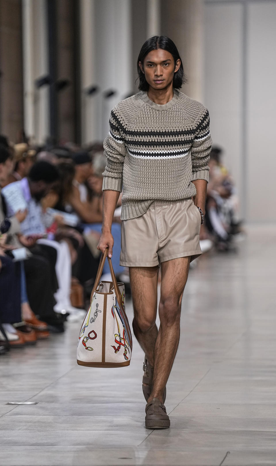 A model wears a creation for the Hermes Menswear Spring/Summer 2024 fashion collection presented in Paris, Saturday, June 24, 2023. (AP Photo/Michel Euler)