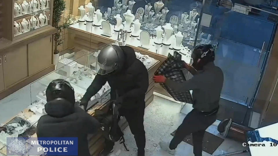 Video grab of members of the gang taking jewellery from the jewellery cases. Video shows the dramatic moment a gang of armed robbers smashed their way into a jewellery shop using a luxury Range Rover, before one the members of the gang was detained by a member of public attempting to get away. See National News story NNraid. A gang of armed robbers smashed their way into a jewellery shop using a luxury Range Rover, before members of the public stopped one of them from running away. Ben Wegener, 34, pleaded guilty to robbery, dangerous driving, and possession of offensive weapon, criminal damage and receiving stolen goods. He and two accomplices drove a black Range Rover through the front of a jewellery shop in Shepherds Bush, west London. When the vehicle narrowly missed the people inside, the robbers got out and then smashed the glass display cases using a sledgehammer and a hammer, and put items of jewellery into bags.