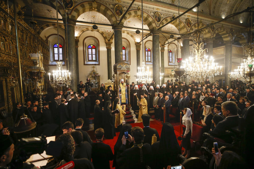 Metropolitan Epiphanius, the head of the independent Ukrainian Orthodox Church, center, attends a religion service during a meeting to sign "Tomos" decree of autocephaly for Ukrainian church at the Patriarchal Church of St. George in Istanbul, Turkey, Saturday, Jan. 5, 2019. (AP Photo/Emrah Gurel)