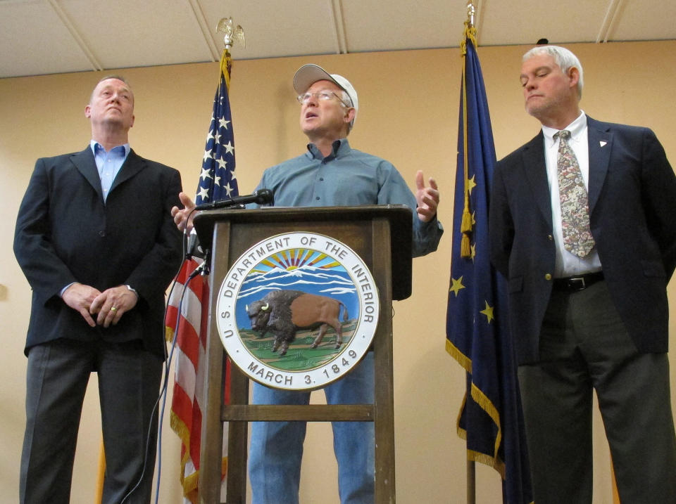 U.S. Interior Secretary Ken Salazar speaks during a news conference Monday, Aug. 13, 2012, in Anchorage, Alaska. On the left is Mike Pool, acting director of the Bureau of Land Management, and Bud Cribley, right, Alaska director for the BLM. Salazar said the proposed plan for the National Petroleum Reserve-Alaska will leave more than half of the 23-million acre reserve available for development or construction of infrastructure, such as a pipeline that could carry oil from leases in the Chukchi Sea to the trans-Alaska pipeline. (AP Photo/Mark Thiessen)