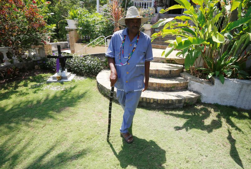 Haitian Voodoo leader Carl Henri Desmornes walks during a ceremony, amid the spread of the coronavirus disease (COVID-19), in Port-au-Prince