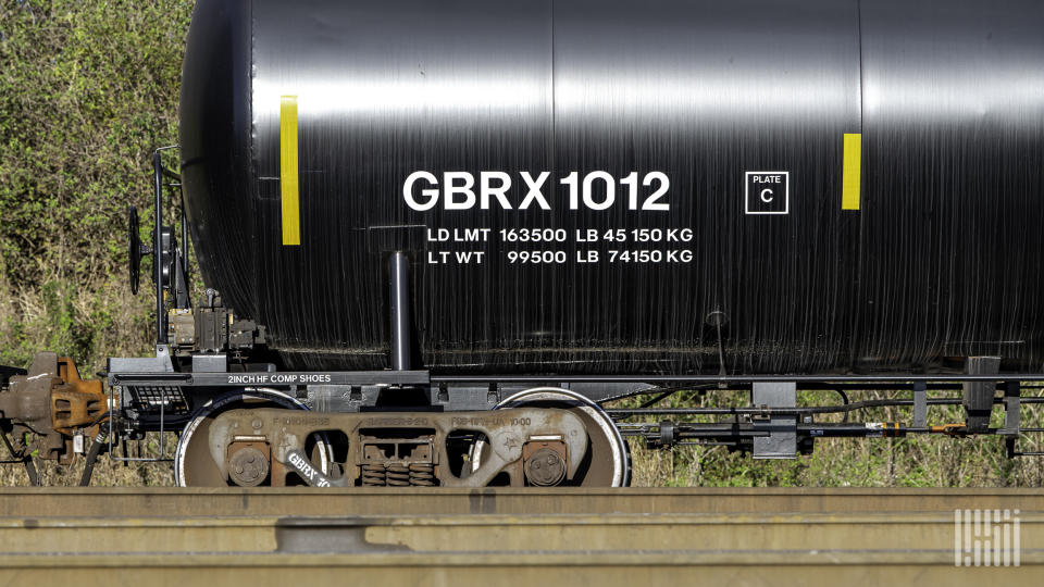 A tank car is parked on railroad track.