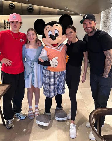 Victoria Beckham/instagram From left: Cruz, Harper, Victoria and David Beckham with Mickey Mouse