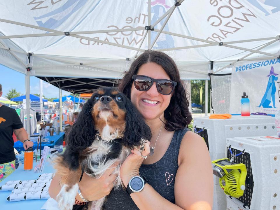 Raquel Crider brought her Cavalier King Charles, Aemon, to support the Dog Wizard (dog training) at Dog Daze VI held at Village Green Shopping Center in Farragut Saturday, Aug. 13, 2022.