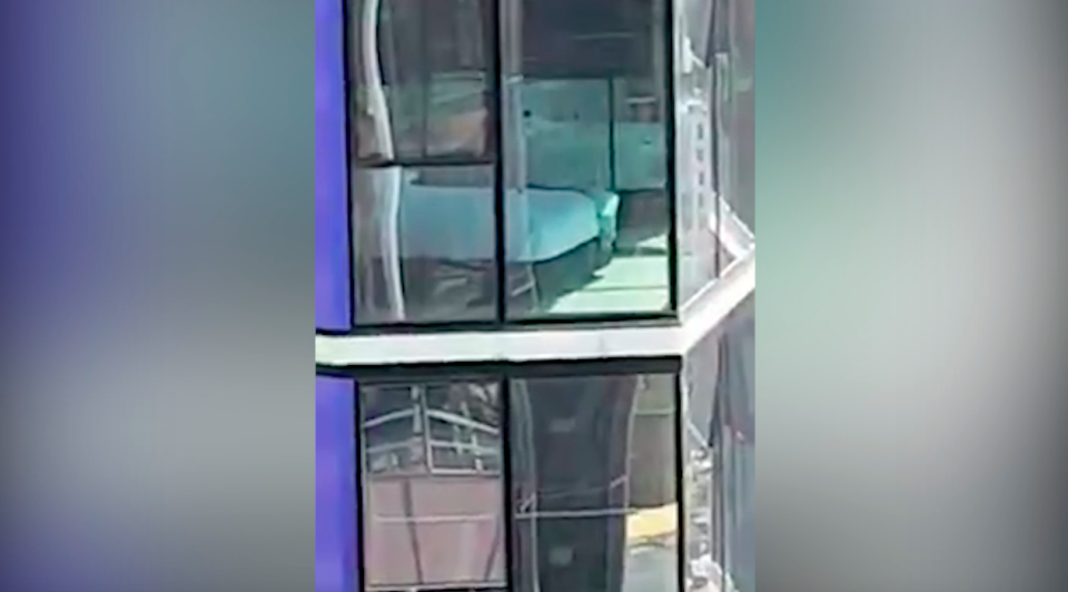 The couple pulled the blinds on their glass windows as soon as they noticed the unwanted audience. Photo: Facebook