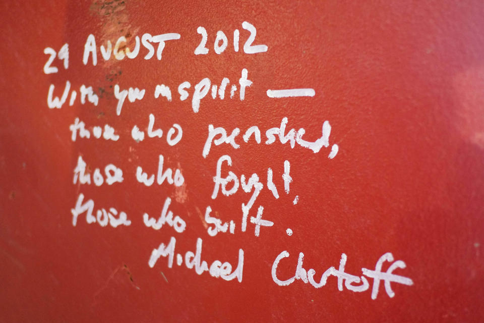 This Jan. 15, 2013 photo shows graffiti left by Michael Chertoff, the former director of Homeland Security, on a steel column on the 104th floor of One World Trade Center in New York. Construction workers finishing New York's tallest building at the World Trade Center are leaving their personal marks on the concrete and steel in the form of graffiti. (AP Photo/Mark Lennihan)