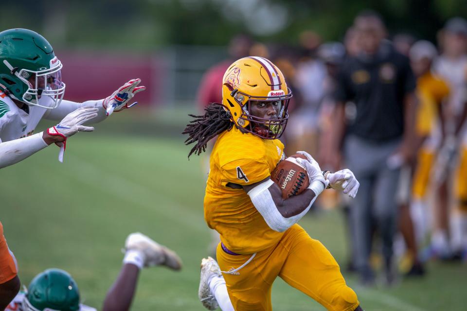 Glades Central Shaborne Demps runs the ball against Atlantic in Belle Glade, Florida on September 9, 2021. 