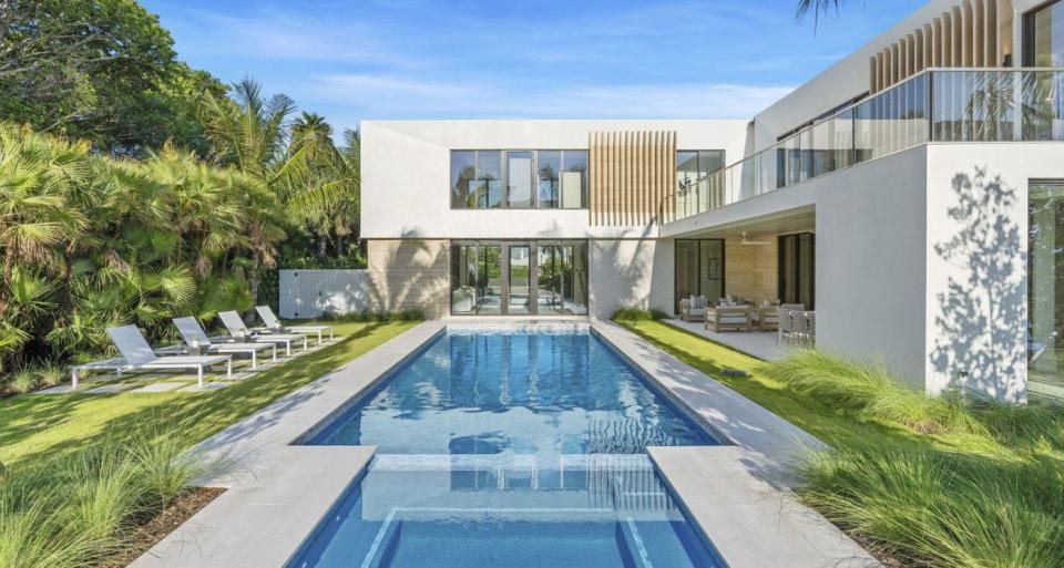 The two wings of a recently completed house at 2291 Ibis Isle Road E. in Palm Beach shelter the pool area. The house just changed hands for a recorded $12.5 million.