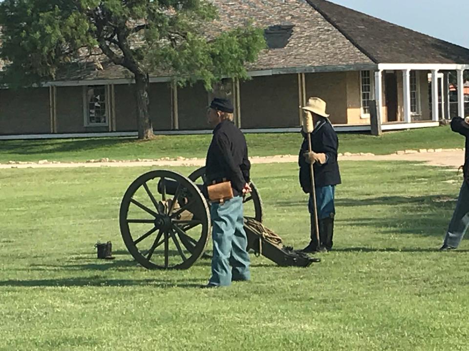 Members of the Fort Concho Living History Program prepare to fire a cannon during a Memorial Day exercise at Fort Concho National Historic Landmark, 630 S. Oakes St., on May 27, 2019.