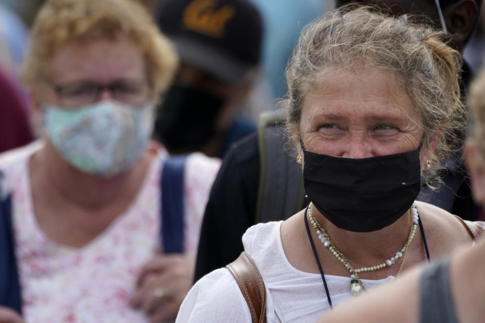 Visitors wear face coverings, Wednesday, Aug. 18, 2021, in Portland, Maine. COVID-19 continues to spread in Maine at increasing rates due to the highly transmissible delta variant. (AP Photo/Robert F. Bukaty)