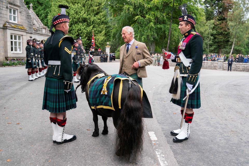 During his inspection, King Charles, center, met with the regiment’s mascot Shetland Pony Corporal Cruachan IV.